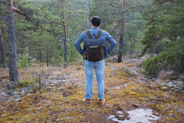 Caucasian young man hiking outdoors in woods - Photo, Image