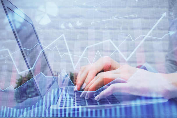 Multi exposure of woman hands typing on computer and forex chart hologram drawing. Stock market analysis concept. - Foto, immagini