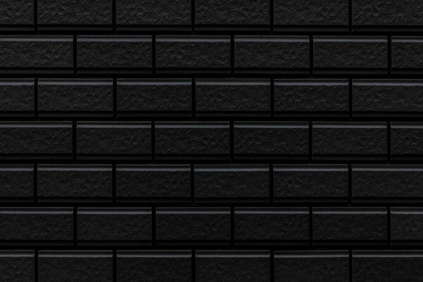 Black brick wall texture and seamless background. Brickwork or stonework flooring interior rock old pattern - Photo, Image