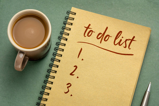 to do list handwriting in a spiral notebook with a cup of coffee, business, productivity, planning and personal development concept - Photo, image