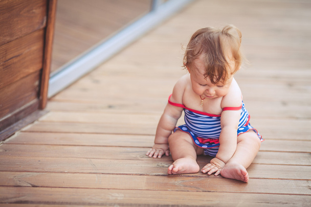 Portrait of adorable infant smiling girl in summer outdoor - Fotó, kép