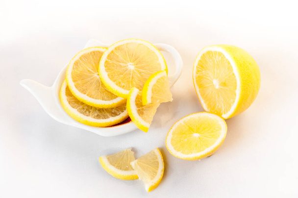 Lemon sliced lies on a plate shaped - Foto, Imagem
