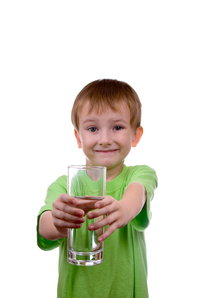 Boy holds a glass of water - Fotó, kép