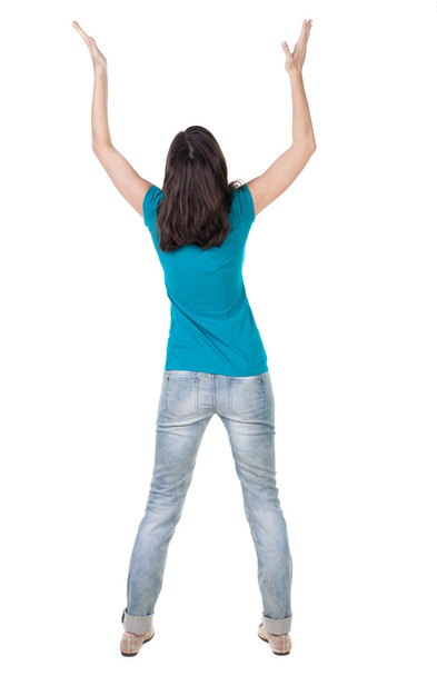 Back view of joyful woman celebrating victory hands up - Fotó, kép