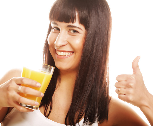 Woman isolated shot drinking orange juice - Fotó, kép