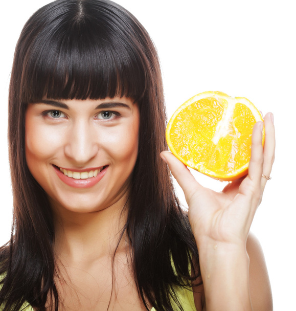 Woman with oranges in her hands - Φωτογραφία, εικόνα