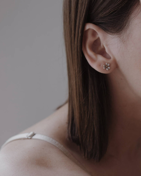 woman ear with dark hair - Foto, Imagem