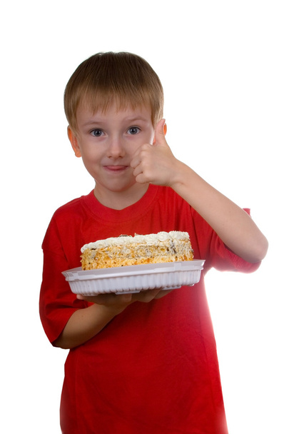Happy boy with a cake - Foto, afbeelding