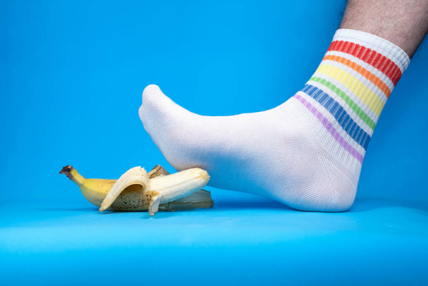 Concept photo of mashing fresh yellow banana, allegory - Photo, Image