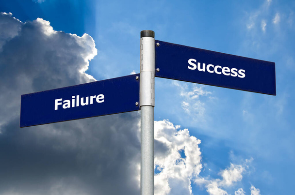 Street sign in front of dark clouds symbolizing contrast between 'failure' and 'success' - Photo, Image