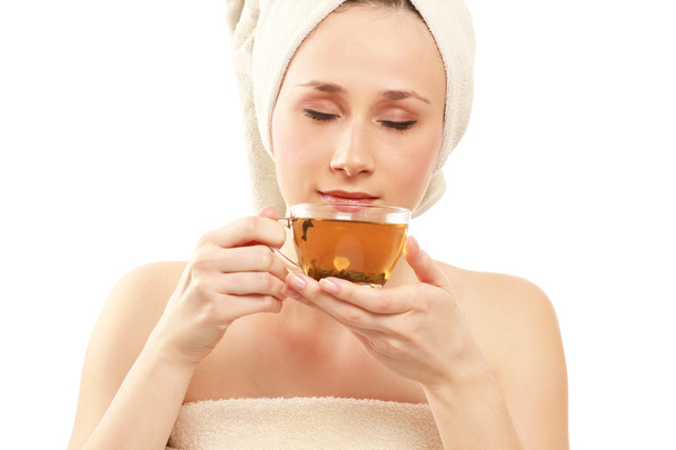 Young woman with a cup of tea after bath - Photo, Image