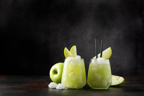 Summer cocktail with green apple and ice. Selective focus image with copy space - Foto, imagen