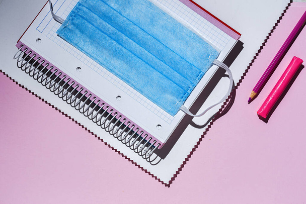 Back to school supplies, notebooks, colored pencils from above. Flat lay. Top view - 写真・画像
