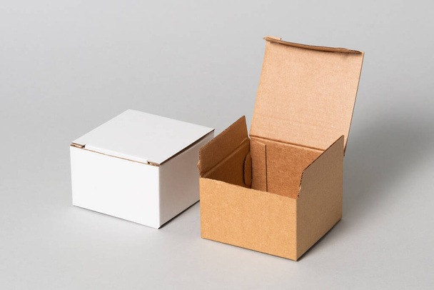 Set of black, brown and white cardboard boxes, isolated - Foto, imagen