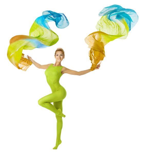 Woman dancing with flying colorful fabric, white background - Fotografie, Obrázek