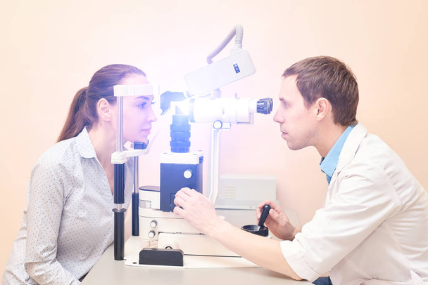 ophthalmologist doctor in exam optician laboratory with male patient. Men - Fotoğraf, Görsel
