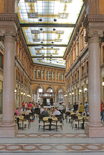 Rome, Italy - June 30, 2014: People sitting at Cafe in Galleria Alberto Sordi Shopping Arcade in Rome, Italy. - Фото, зображення