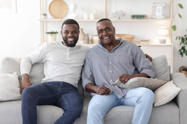 Portrait With Dad. Happy Black Man Posing With Mature Father At Home - Foto, imagen