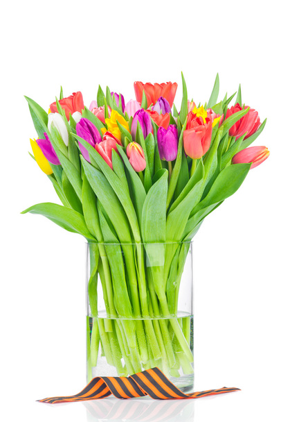 Tulips in the vase and a ribbon - Фото, изображение