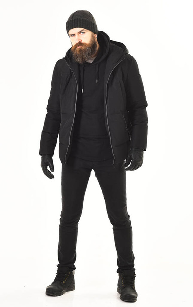 Winter clothes concept. Guy wears black and brutal outfit. - 写真・画像