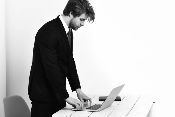 Caucasian stylish business man working with laptop - Fotografie, Obrázek