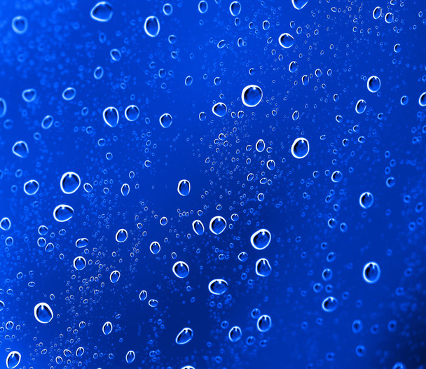 Blue Abstract Water Drops Background . Photo of an abstract texture - Фото, зображення