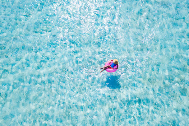 Top above high angle aerial drone view of her she slim fit attractive girl floating on rubber ring in pure sea water dream tour enjoy joy sunny day peaceful activity leisure spend summertime season - Foto, imagen