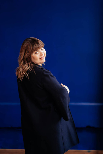 rear view. pregnant with overweight in blue jacket - Photo, Image