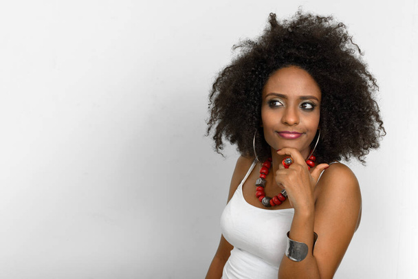 Studio shot of young beautiful African woman with Afro hair against white background - Valokuva, kuva