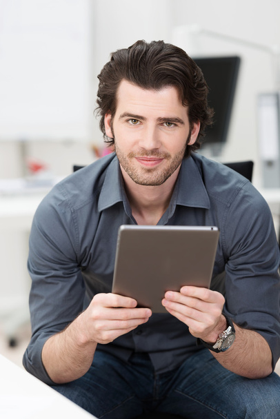 Businessman holding a tablet computer - Fotó, kép