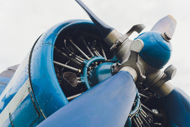 Close up view of a vintage propeller passenger and cargo airplane. - Фото, зображення