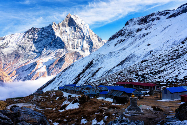 Panorama of Mount Machapuchare (Fishtail) at sunset, view from Annapurna base camp in the Nepal Himalaya. Machhapuchchare is a mountain in the Annapurna Himal of north Central Nepal - Foto, Imagen