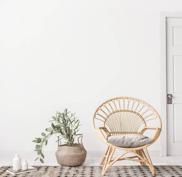 Woonkamer interieur met rieten fauteuil en eucalyptus plant, witte muur mock up achtergrond, 3D render - Foto, afbeelding