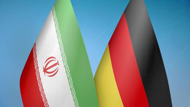 Iran und Deutschland zwei Flaggen zusammen blauer Hintergrund - Foto, Bild