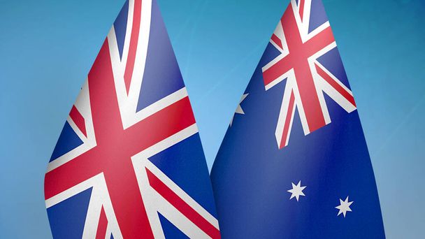 Reino Unido e Austrália duas bandeiras juntos fundo azul
 - Foto, Imagem
