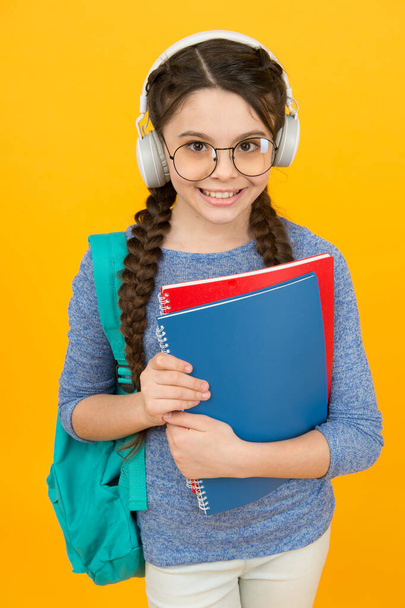 English library online. Happy kid wear headphones. English learning courses. Listening skills. Literature and grammar. English school. Modern life. New technology - 写真・画像
