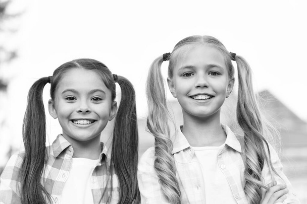 Perfection in beauty. Happy kids with long hair tails. Beauty look of small girls. Beauty shop. Hair salon. Fashion and beauty. Haircare and skincare products. We are here to beautify the world - Fotoğraf, Görsel