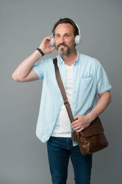 Mature man enjoy music stereo modern headphones, audio book concept - Foto, imagen