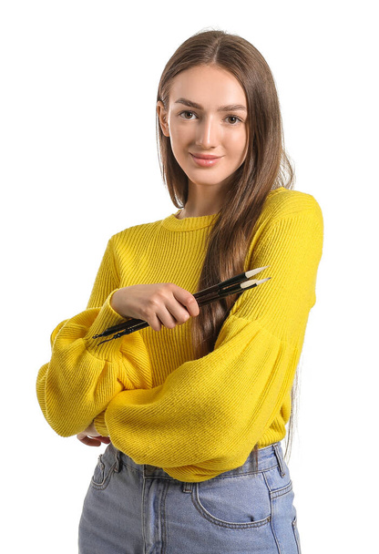 Fiatal női kalligráfus fehér háttér - Fotó, kép