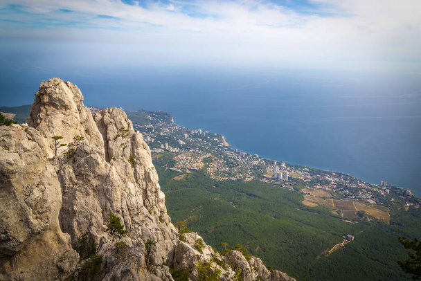 A beautiful landscape on the top of Mount Ai Petri, the town of Gaspra and the Black Sea in Crimea, background with vignette. - Photo, image