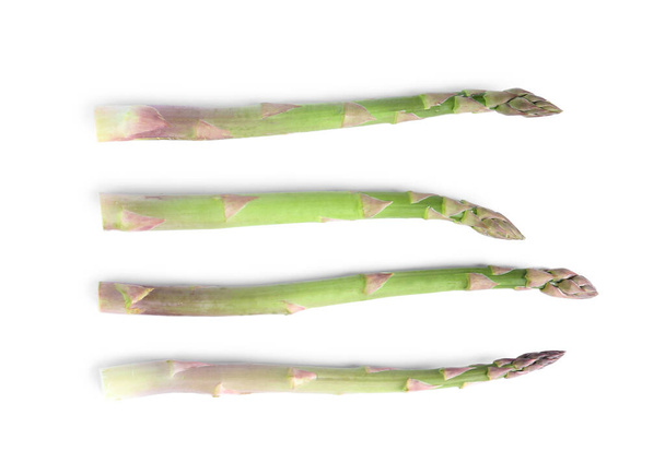 Fresh raw asparagus isolated on white, top view - Foto, Imagen