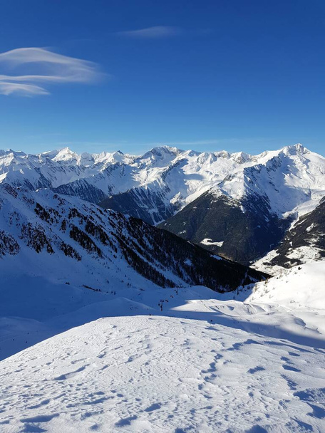 A beautiful landscape of snowy mountains on background of blue sky - Φωτογραφία, εικόνα