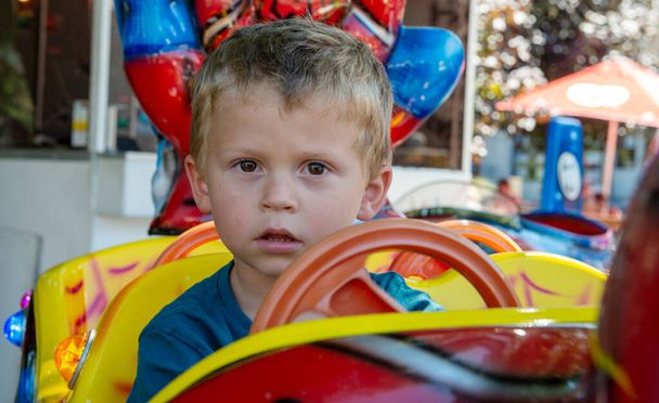 a portrait of little boy in a merry-go-round - Fotoğraf, Görsel