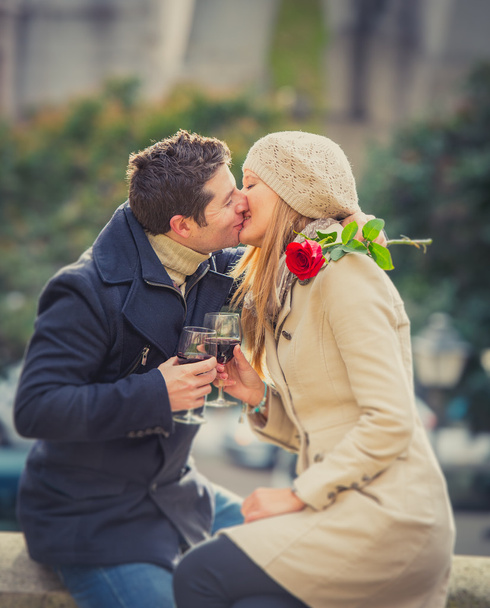 couple with a rose kissing on valentines day - Photo, Image