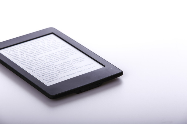 black ebook reader or tablet on white background - 写真・画像