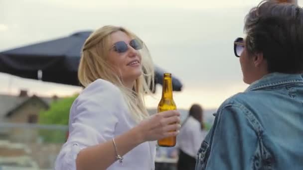Smiling Women Having Fun, Drinking Beer And Dancing Outdoors. - Materiał filmowy, wideo