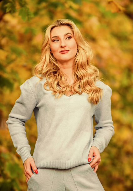 Feeling the beauty of nature. Woman enjoy autumn in park. Girl relax nature fallen leaves. Clothes for rest. cosy sport suit. Sporty girl. wear comfort clothes. knitwear clothes for fall season - Zdjęcie, obraz