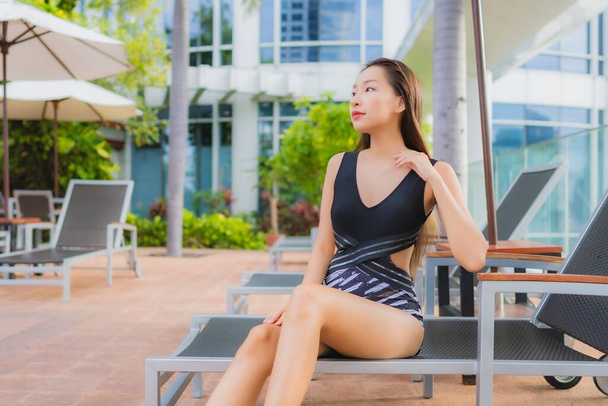Portrait beautiful young asian woman leisure relax smile around outdoor swimming pool for vacation - Photo, Image