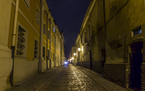 Night photo of a cobbled street in the old part of Poznan, Polan - Valokuva, kuva