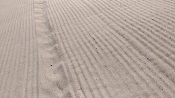 Písek na pláži poté, co byl vyhlazen - Fotografie, Obrázek